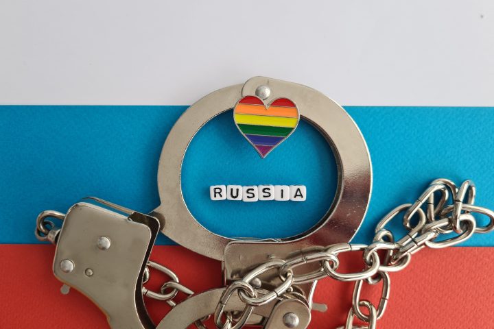 Ban Russia and rainbow flag and handcuffs. LGBT conflict and rights concept